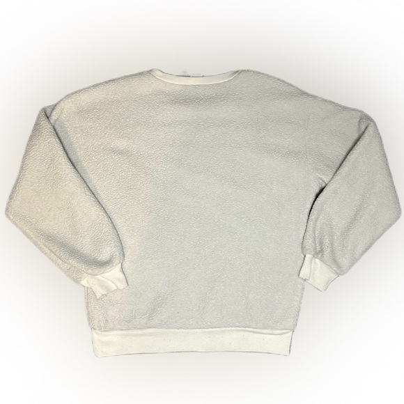 Disney’s Minnie Mouse Sherpa pullover. White with fuzzy sherpa Minnie face.​​ - Picture 2 of 4